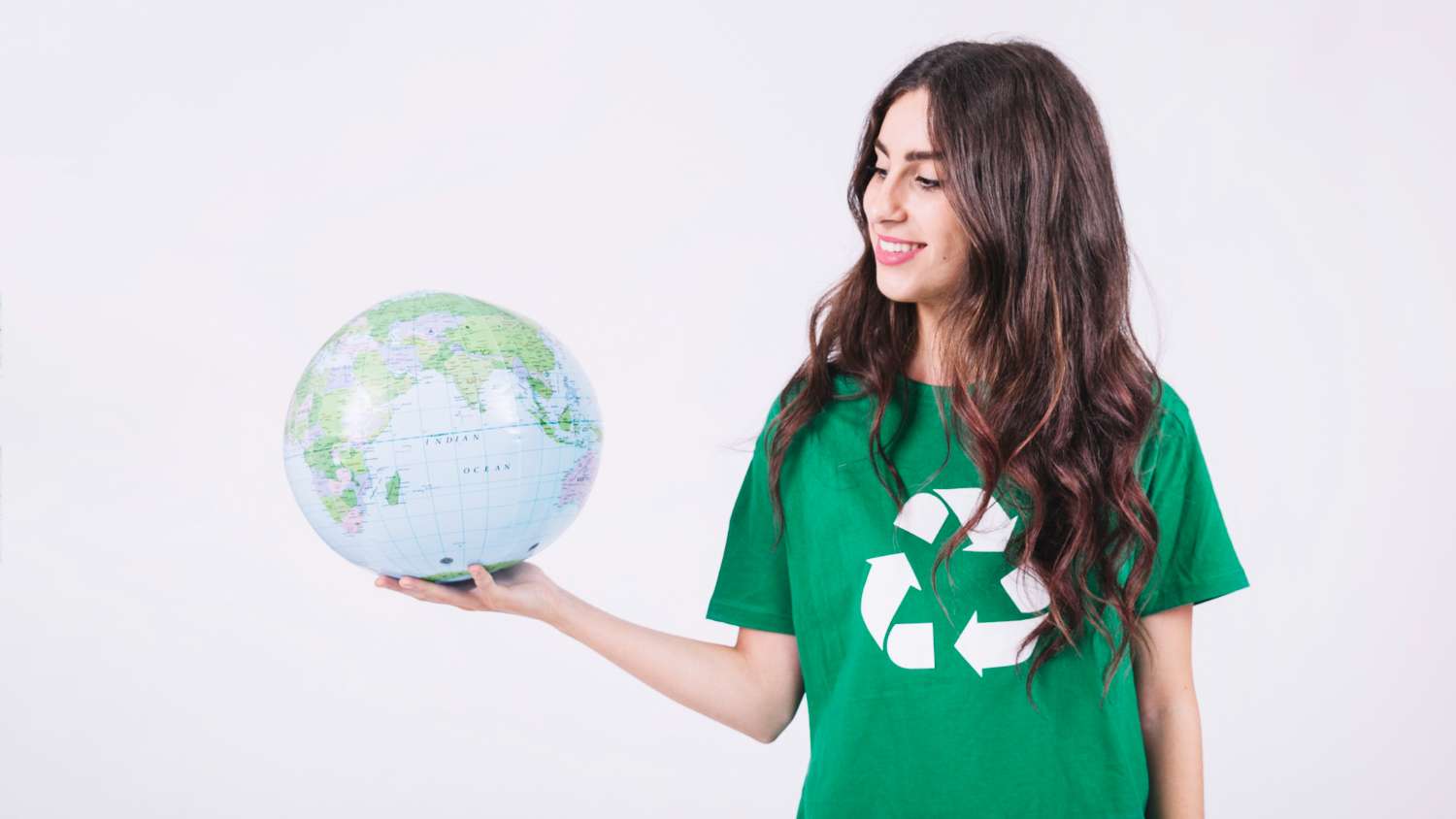 smiling-young-woman-looking-globe